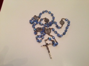 The center medal of this rosary shows Our Lady of the Snows.  